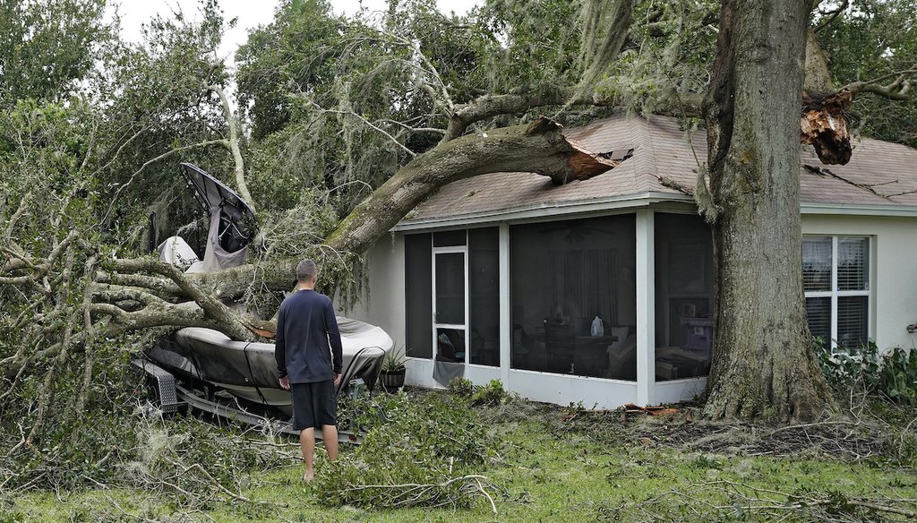 A homeowner surveys the damage wrought by Hurricane Ian in Valrico, Florida, Sept. 29, 2022