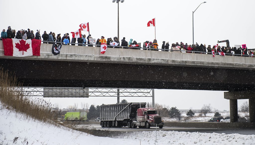 Protestors show their support for the Freedom Convoy of truck drivers making their way to Ottawa to protest against COVID-19 vaccine mandates by the Canadian government on Thursday, Jan. 27, 2022, in Vaughan. (Photo by Arthur Mola/Invision/AP)