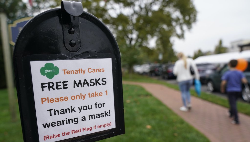 A mailbox containing free masks for pedestrians stands in the center of Tenafly, N.J., on Oct. 22, 2020.