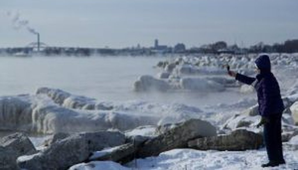 Someone takes a picture along the shore of Lake Michigan with temperatures in the negative digits on Jan. 7, 2014, in Milwaukee. A "polar vortex" of frigid air centered on the North Pole had dropped temperatures precipitously. (Getty Images)