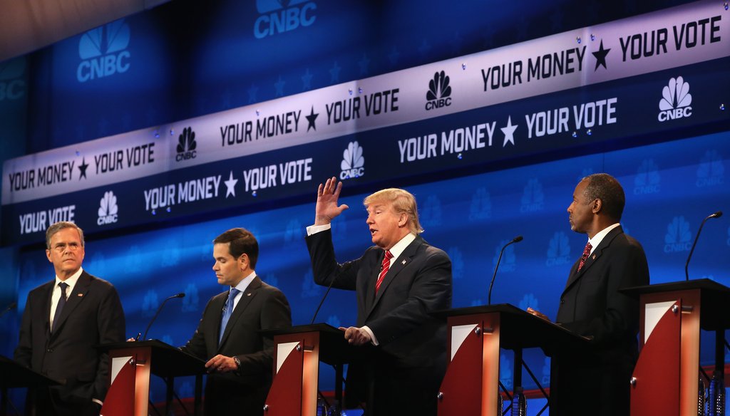 Donald Trump speaks as Jeb Bush, Marco Rubio, and Ben Carson look on during the CNBC Republican presidential debate on Oct. 28, 2015. (AP Photo)