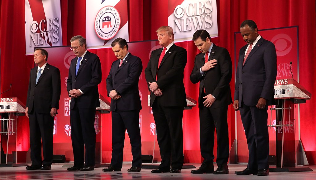 The Republican presidential candidates observe a moment of silence for Supreme Court Justice Antonin Scalia, who died the same day as the CBS debate on Feb. 13, 2016. (Getty)