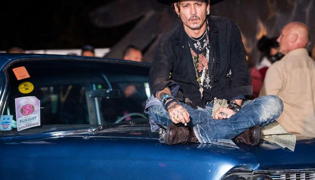 A series of fake news posts said that Johnny Depp died after federal authorities picked him up for threatening President Donald Trump. (Getty Images)