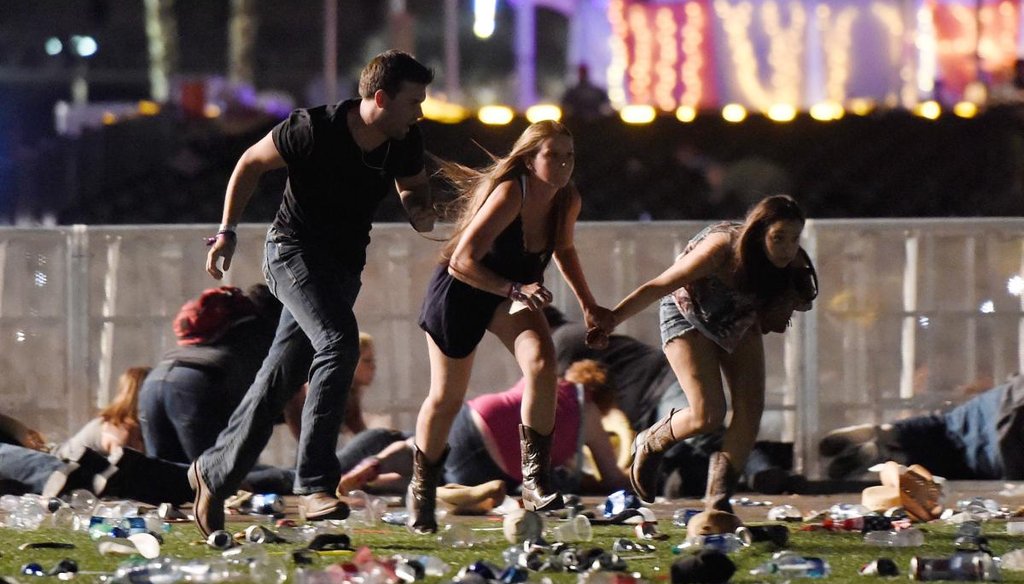 People run from the Route 91 Harvest country music festival after apparent gun fire was hear on Oct. 1, 2017, in Las Vegas, Nev. A gunman has opened fire on a music festival in Las Vegas, leaving at least 50 people dead and more than 400 injured. (Getty)