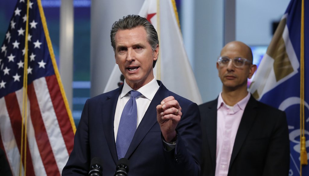 California Gov. Gavin Newsom gives an update to the state's response to the coronavirus on March 17, 2020. At right is California Health and Human Services Agency Director Dr. Mark Ghaly. (AP Photo/Rich Pedroncelli, Pool)