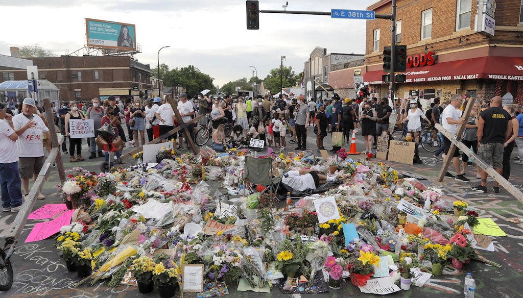 People gather around a makeshift memorial for George Floyd, Wednesday, June 3, 2020, in Minneapolis. Floyd was killed in May 2020 after being restrained by Minneapolis police officers. (AP)