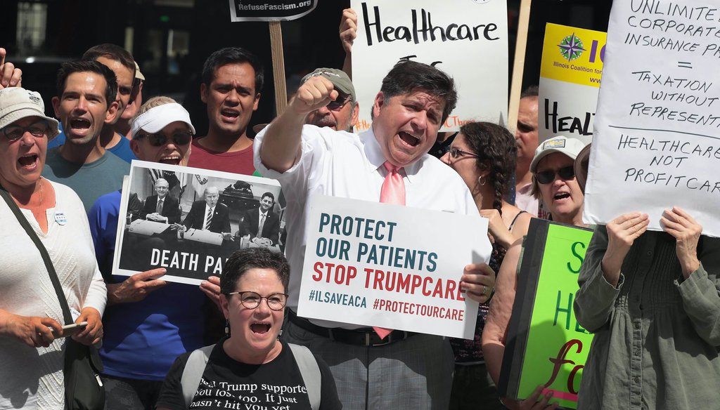 Then-candidate for Illinois governor J.B. Pritzker joins demonstrators protesting changes to the Affordable Care Act on June 22, 2017 in Chicago, Illinois. (Scott Olson/Getty Images)