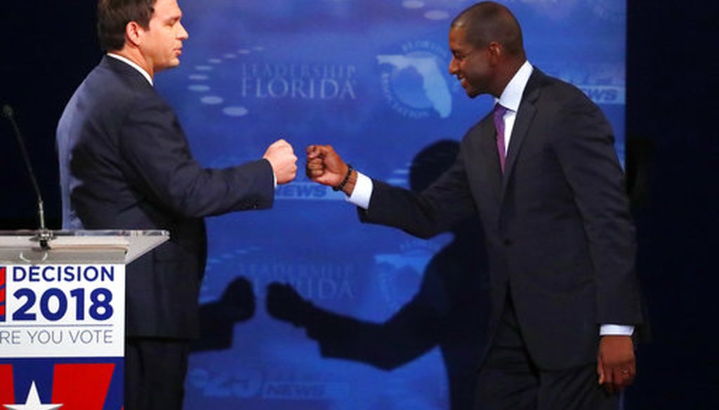 Florida gubernatorial candidates, Republican Ron DeSantis, left, and Democrat Andrew Gillum fist bump after a debate, Wednesday, Oct. 24, 2018, at Broward College in Davie, Fla. (AP)