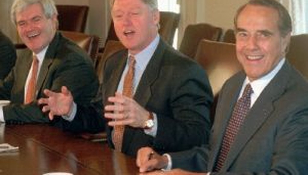 Then-House Speaker Newt Gingrich, R-Ga., and President Bill Clinton, shown with former Senate Majority Leader Bob Dole, R-Kan., in 1995, a few months before two federal government shutdowns occurred.