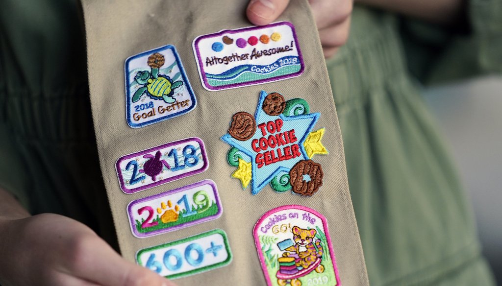 A Girl Scout displays merit badges Nov. 1, 2020, that she has been awarded for selling Girl Scout Cookies in Jonesborough, Tenn. (AP)