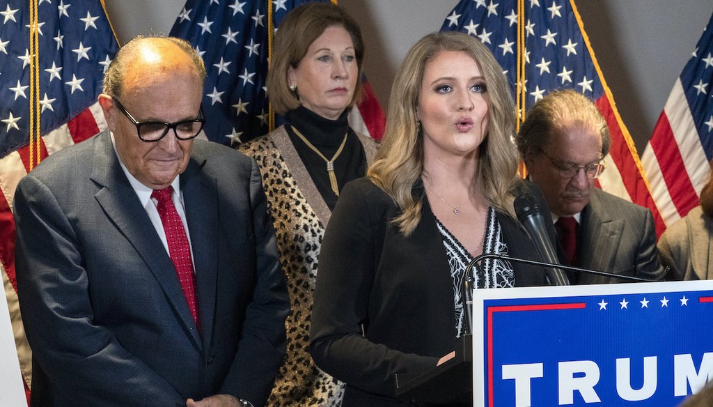 Members of President Donald Trump's legal team, including former Mayor of New York Rudy Giuliani, left, Sidney Powell, and Jenna Ellis, speaking, attend a news conference at the Republican National Committee headquarters in Washington, Nov. 19, 2020. (AP)