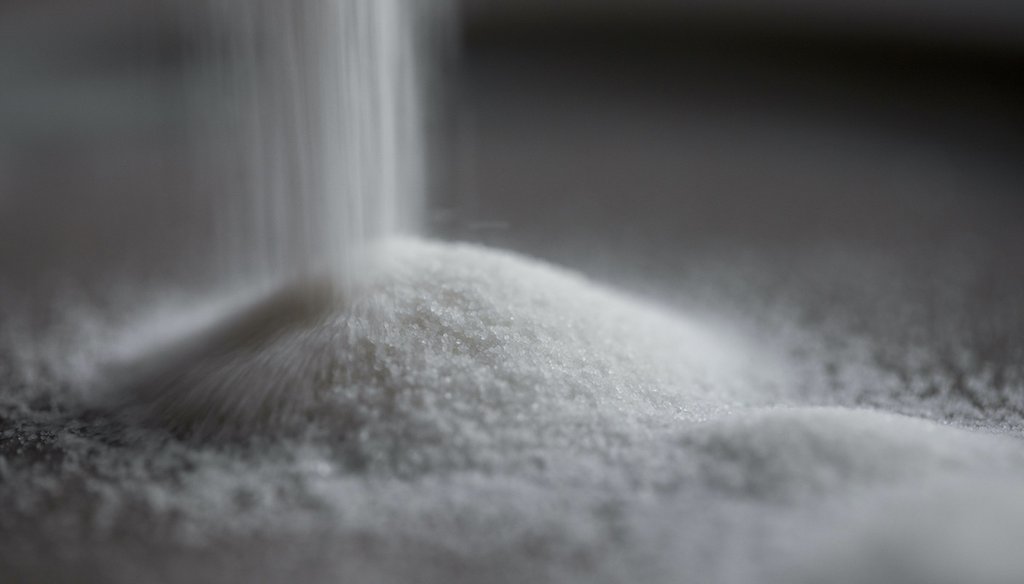 Granulated sugar is poured in Tigard, Ore., Tuesday, Nov. 23, 2021. (AP)