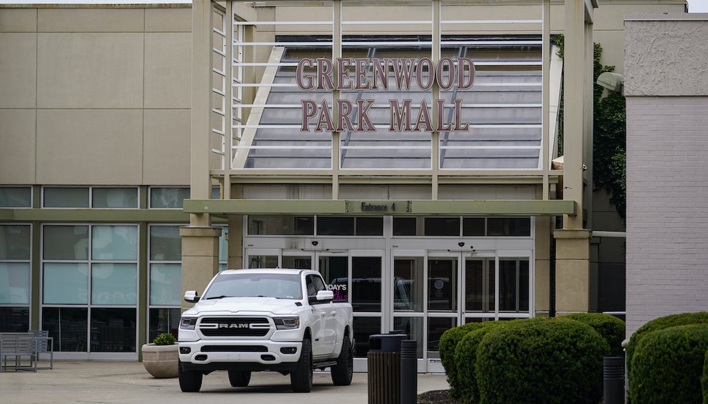 A truck blocks the entrance to the closed Greenwood Park Mall in Greenwood, Indiana on July 18, 2022. The mall was closed after police say three people were fatally shot and two were injured after a man with a rifle opened fire inside. (AP)