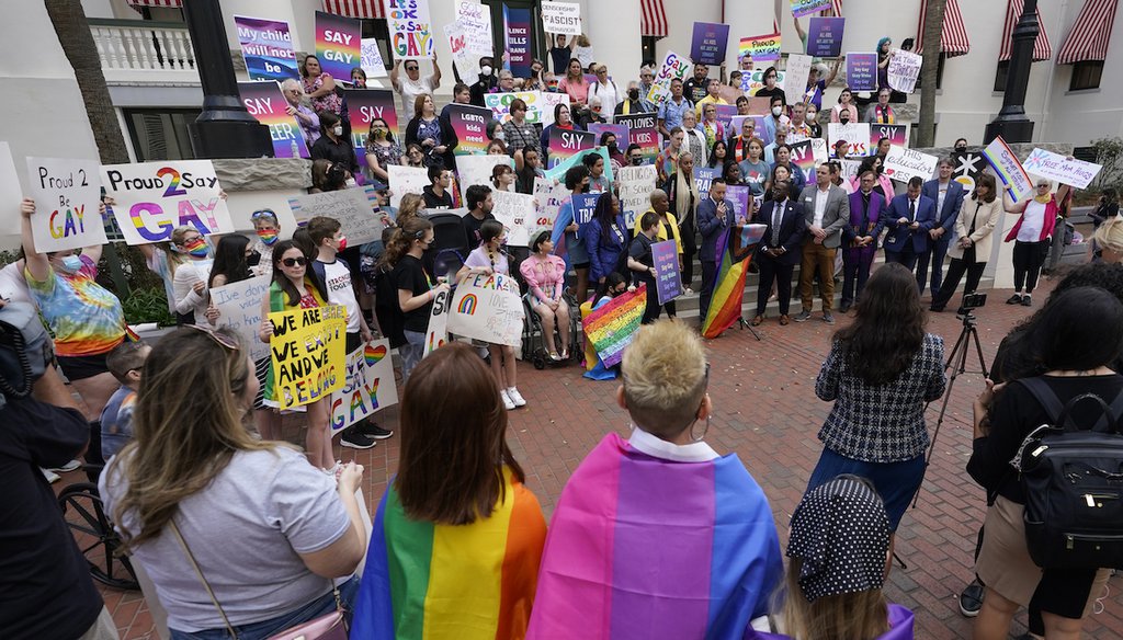 Demonstrators gather on the steps of the Florida Historic Capitol Museum in front of the Florida State Capitol on March 7 in Tallahassee. (AP)