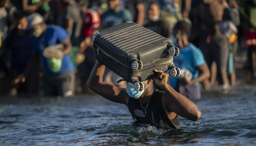 Migrants, many from Haiti, wade across the Rio Grande from Del Rio, Texas, to return to Mexico, Sept. 20, 2021, to avoid deportation from the U.S. (AP)