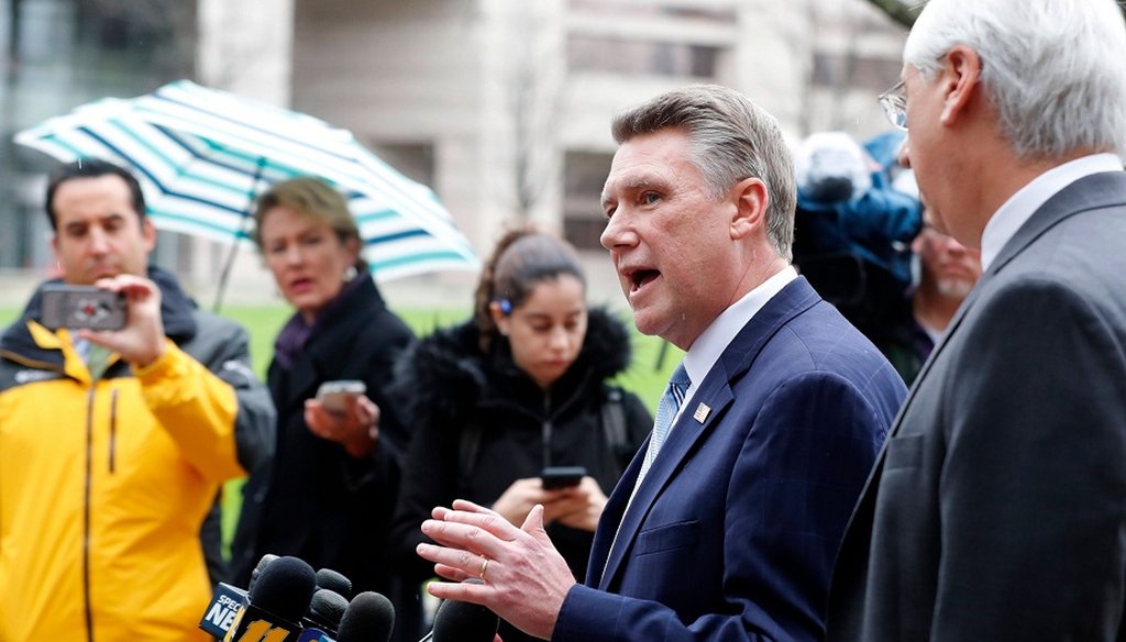 Republican Mark Harris, left, and his attorney David Freedman speak with the media after meeting with state election investigators at the Dobbs Building in Raleigh, N.C., Thursday, Jan. 3, 2019. (News & Observer)