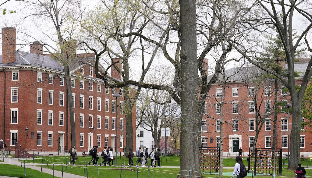 Students walk through Harvard Yard on April 27, 2022, on the campus of Harvard University in Cambridge, Mass. (AP)