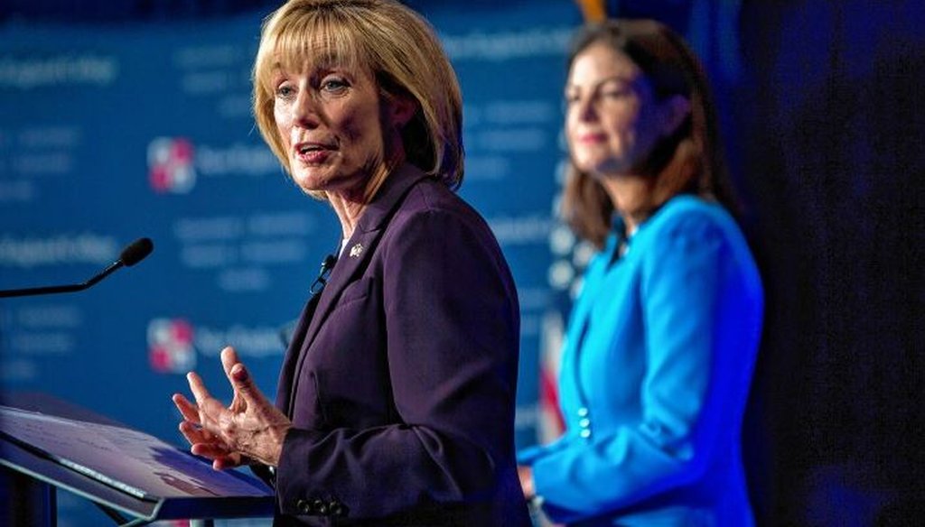 Gov. Maggie Hassan answers a question as Sen. Kelly Ayotte looks on at New England College. GEOFF FORESTER / Concord Monitor