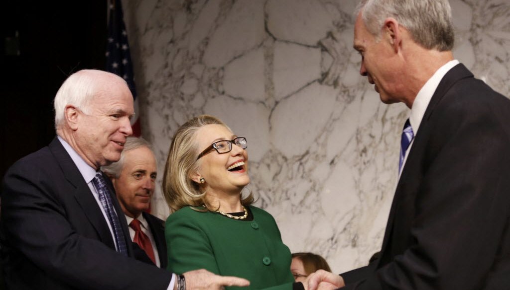 Then-Secretary of State and U.S. Sen. Ron Johnson, R-Wis., greeted each other prior to a Senate committee hearing on Jan. 23, 2013 in this Reuters photo. 
