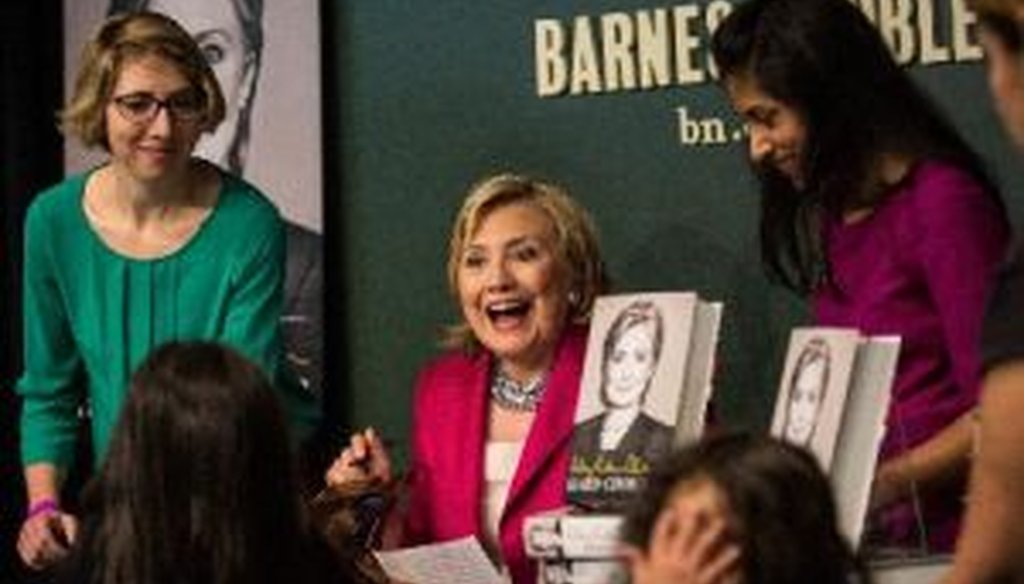 Former Secretary of State Hillary Clinton signs her new book, "Hard Choices," June 10, 2014, in New York City.