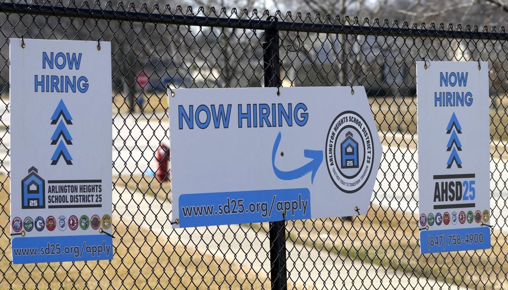 Hiring signs are seen Feb. 26, 2024, in Arlington Heights, Ill. (AP)