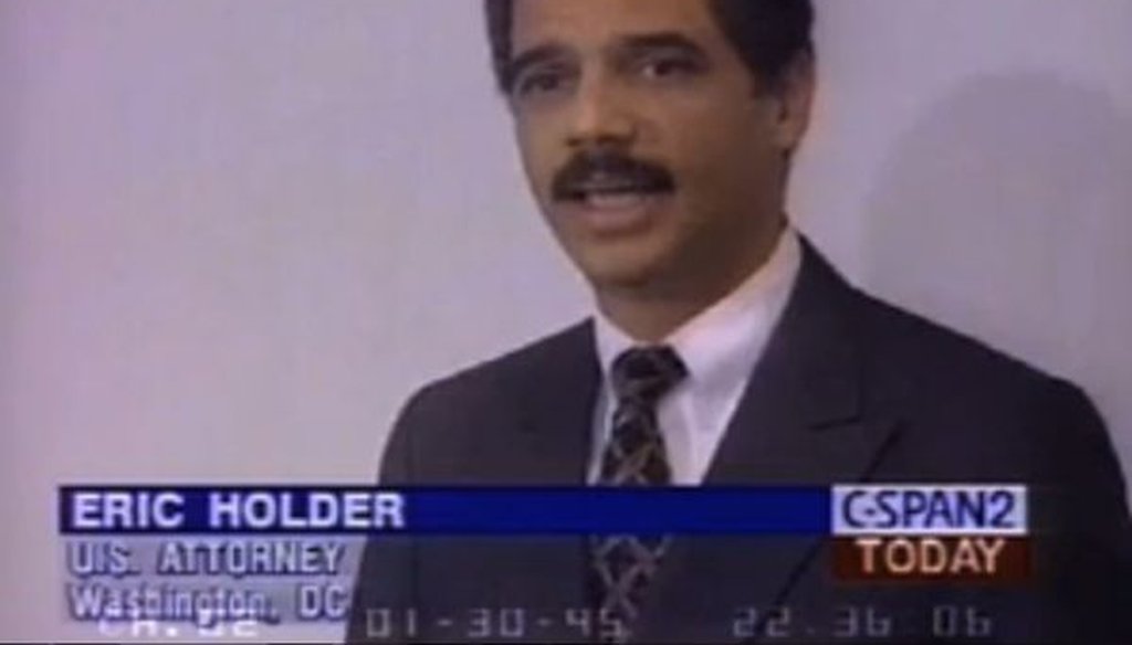 This is a screenshot from a video of a 1995 speech by Eric Holder, the future attorney general.