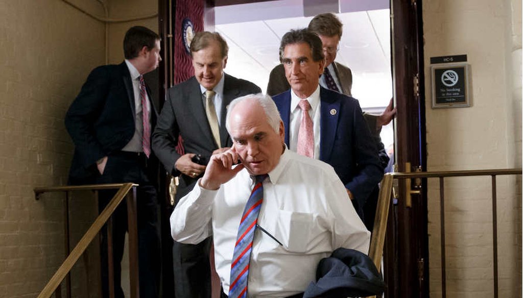 Rep. Mike Kelly, R-Pa., center, and other House Republicans emerge from a closed-door meeting in the basement of the Capitol. The House approved a one-week extension of funding for the Department of Homeland Security, avoiding a partial shutdown. (AP)