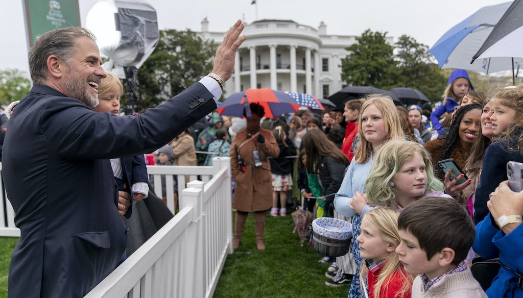 Hunter Biden, left, the son of President Joe Biden, holds his son, Beau Biden, and waves to people in the audience during the White House Easter Egg Roll on the South Lawn of the White House, Monday, April 18, 2022, in Washington. (AP)