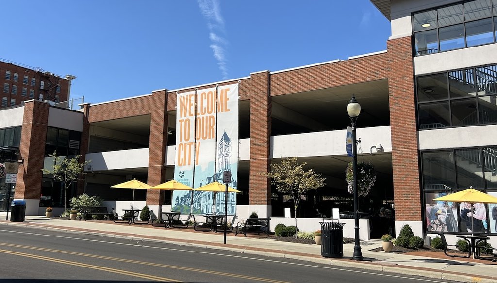 A banner with "Welcome To Our City," printed on it hangs outside a building in Springfield, Ohio, Sept. 12, 2024. (Maria Ramirez Uribe/ PolitiFact)