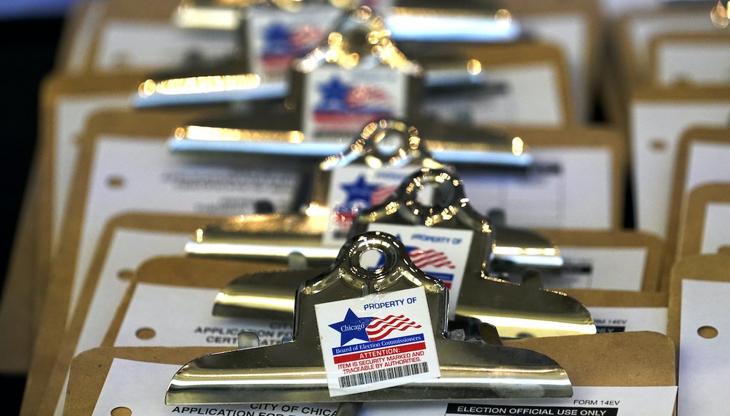 Clipboards with voter registration forms sit on a table on Election Day, Tuesday, Nov. 3, 2020, at the United Center sports complex, a new super voting site in Chicago. (AP)