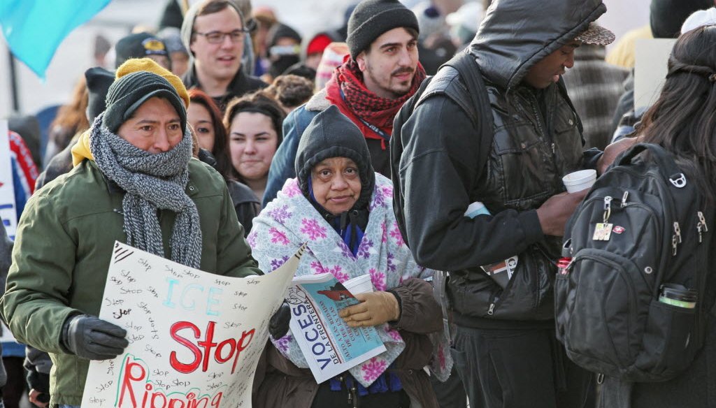 People rallied in Milwaukee in February 2014 to protest the detention and deportation of some Latinos who show up at courthouses for traffic tickets and get detained by immigration officials.