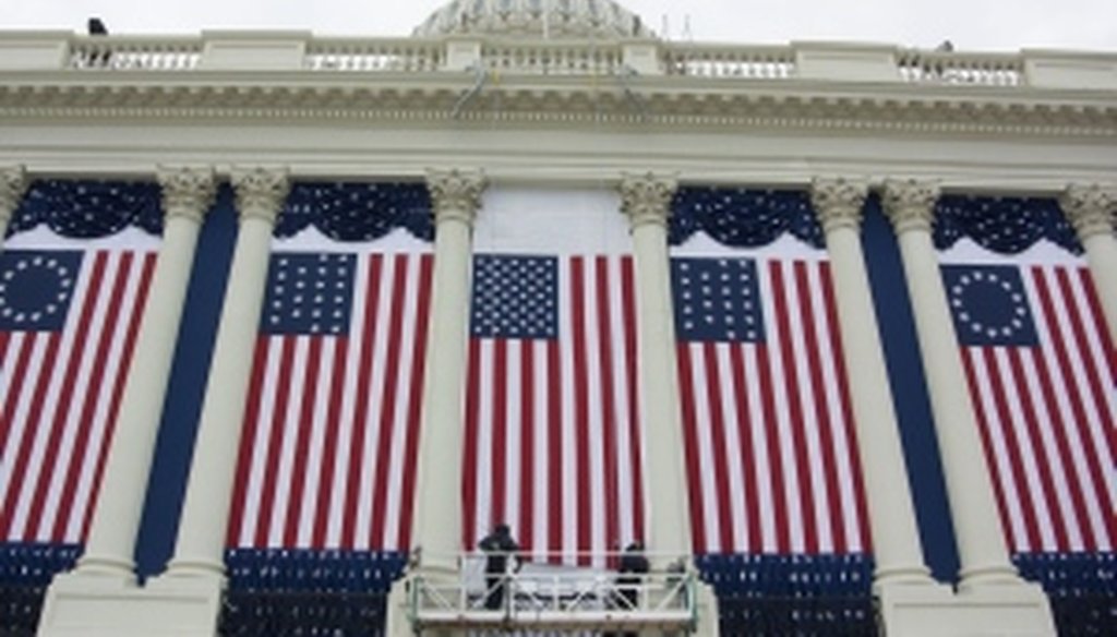 Workers prepare the West Front of the Capitol for the inauguration ceremonies. (McClatchy photo by George Bridges)