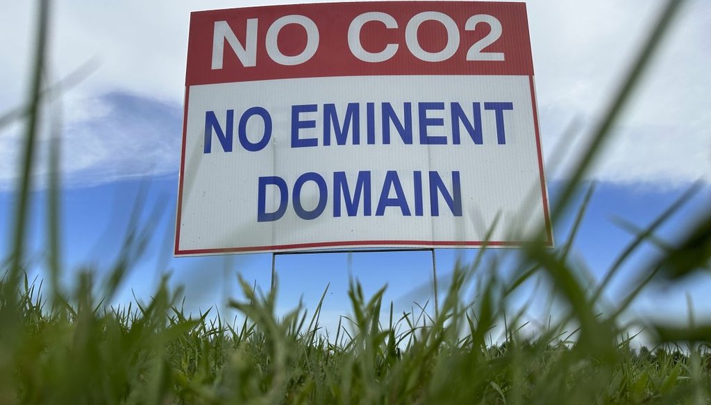 A sign stands along a rural road east of Bismarck, N.D., protesting a proposed carbon dioxide pipeline like one proposed in Iowa. (AP)