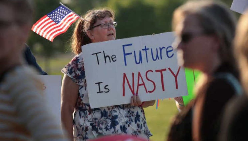 A protester outside a Cedar Rapids town hall meeting with Rep. Rod Blum, R-Iowa. (Getty)