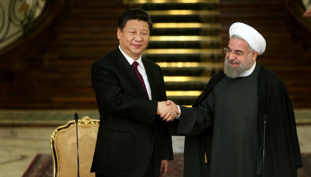 Chinese President Xi Jinping (left) and Iranian President Hassan Rouhani held a news conference in Tehran days after the lifting of international sanctions under a deal to keep Iran from getting a  nuclear bomb. (AP photo)