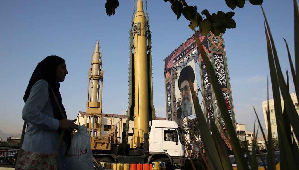 In this Sept. 24, 2017 AP file photo, a Ghadr-H missile, center, a solid-fuel surface-to-surface Sejjil missile and a portrait of the Supreme Leader Ayatollah Ali Khamenei are displayed at Baharestan Square in Tehran, Iran. 