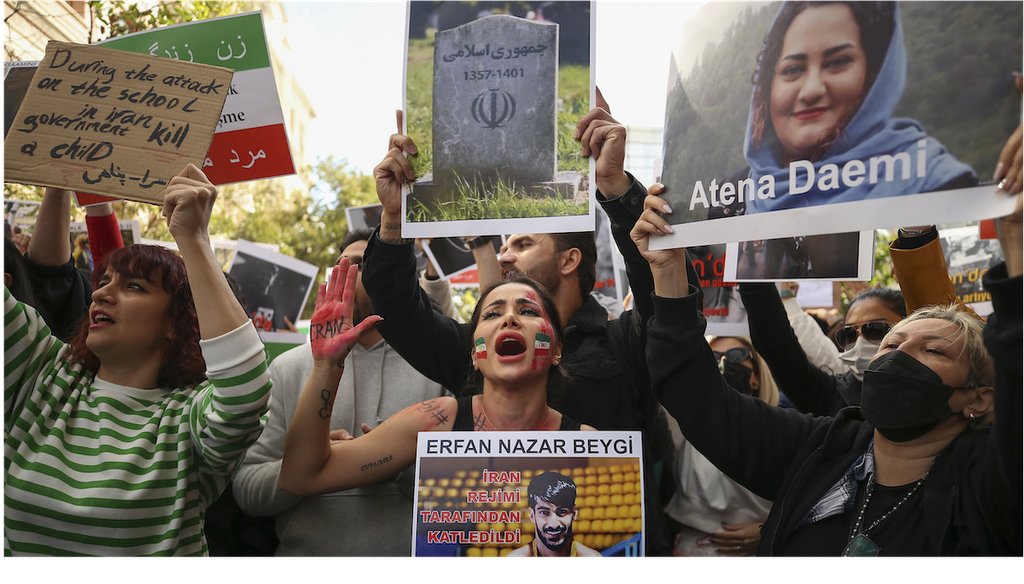 Iranian women shout slogans to protest over the death of Mahsa Amini during a demonstration outside the Iranian consulate in Istanbul, Turkey, Monday, Oct. 17, 2022. (AP)