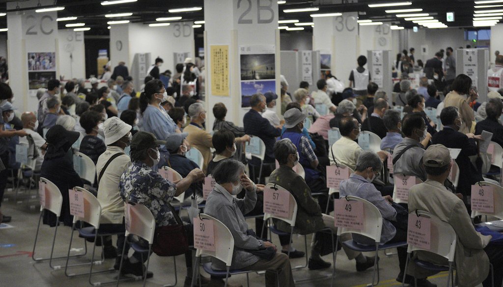 Local residents wait to receive a COVID-19 vaccine in June, 2021, at a mass vaccination center in Yokohama, near Tokyo. (AP)