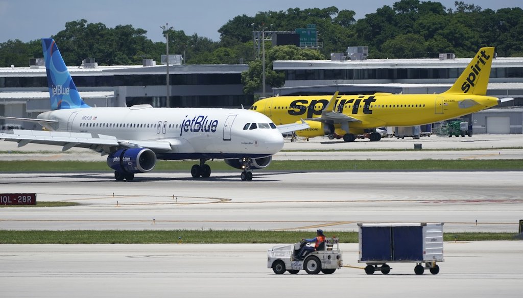 A JetBlue Airways Airbus A320, left, passes a Spirit Airlines Airbus A320 as it taxis on the runway, July 7, 2022, at the Fort Lauderdale-Hollywood International Airport in Fort Lauderdale, Fla. (AP)