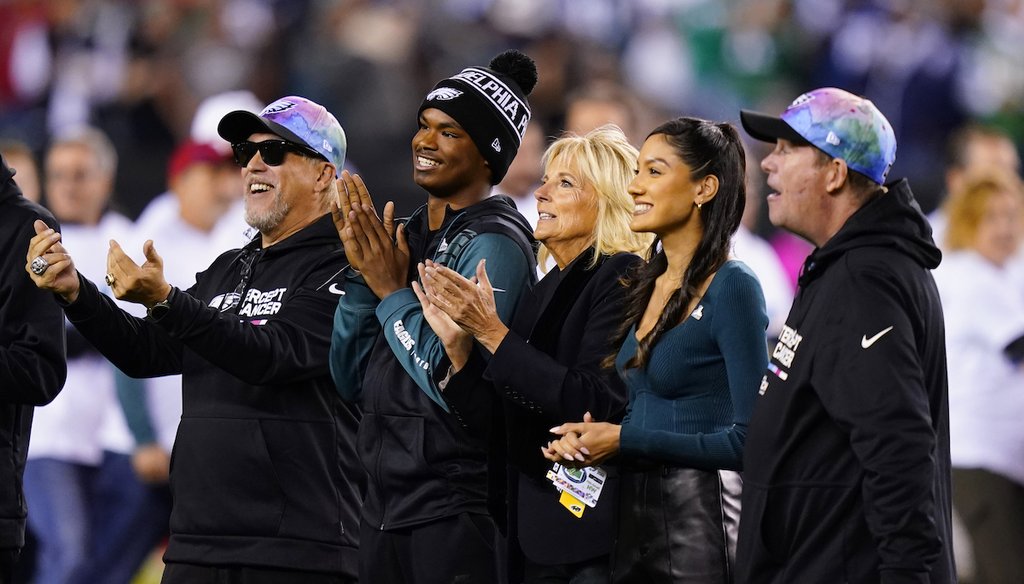First lady Jill Biden, center, stands on the field before an NFL football game between the Philadelphia Eagles and Dallas Cowboys on Oct. 16, 2022