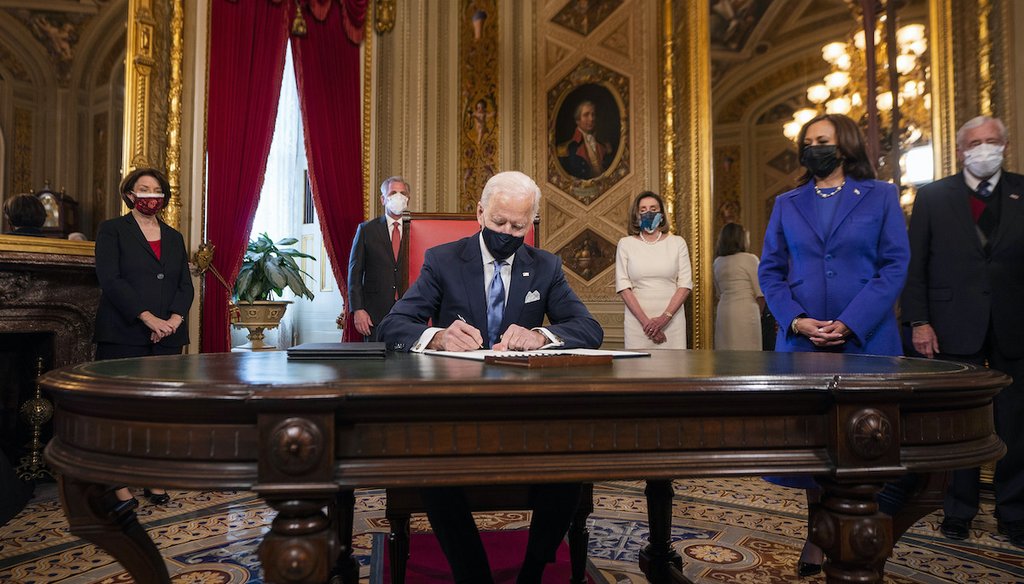 President Joe Biden signed three documents at the U.S. Capitol shortly after being inaugurated on Jan. 20, 2021. Vice President Kamala Harris is at Biden's left. (AP)