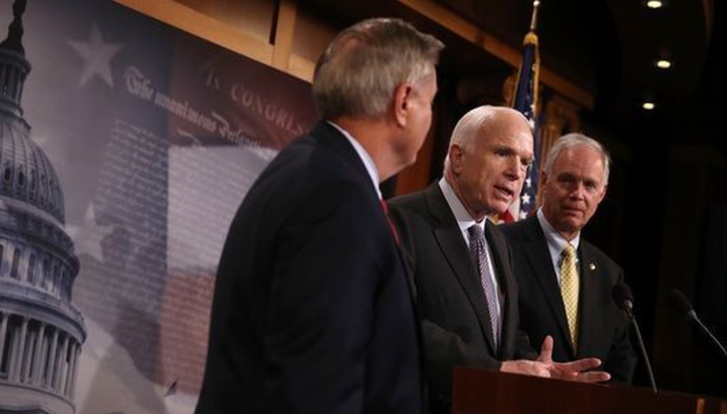 U.S. Sen. Ron Johnson (right) walked back comments he made about a fellow Republican, U.S. Sen. John McCain (center) and McCain's brain cancer. U.S. Sen. Lindsey Graham is also pictured. (Justin Sullivan/Getty Images)