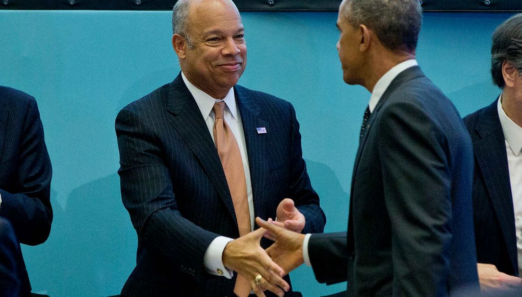 Homeland Security Secretary Jeh Johnson shakes President Barack Obama's hand during a break in a summit on countering violent extremism held in Washington. (AP)