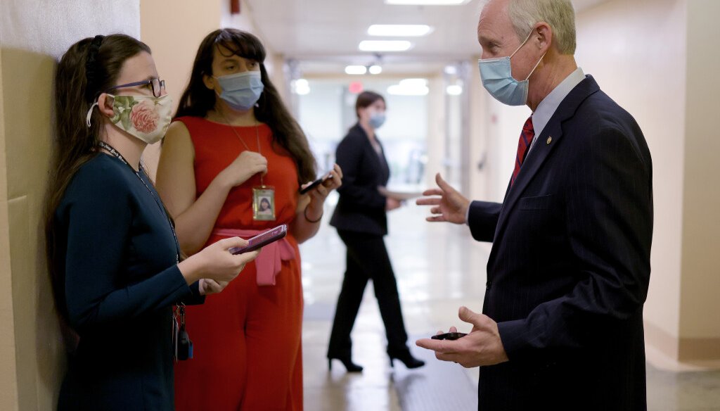 Sen. Ron Johnson (R-WI) talks with reporters while walking to the U.S. Senate chamber for a vote March 05, 2021 in Washington, DC. The Senate continues to debate the latest COVID-19 relief bill. (Photo by Win McNamee/Getty Images)