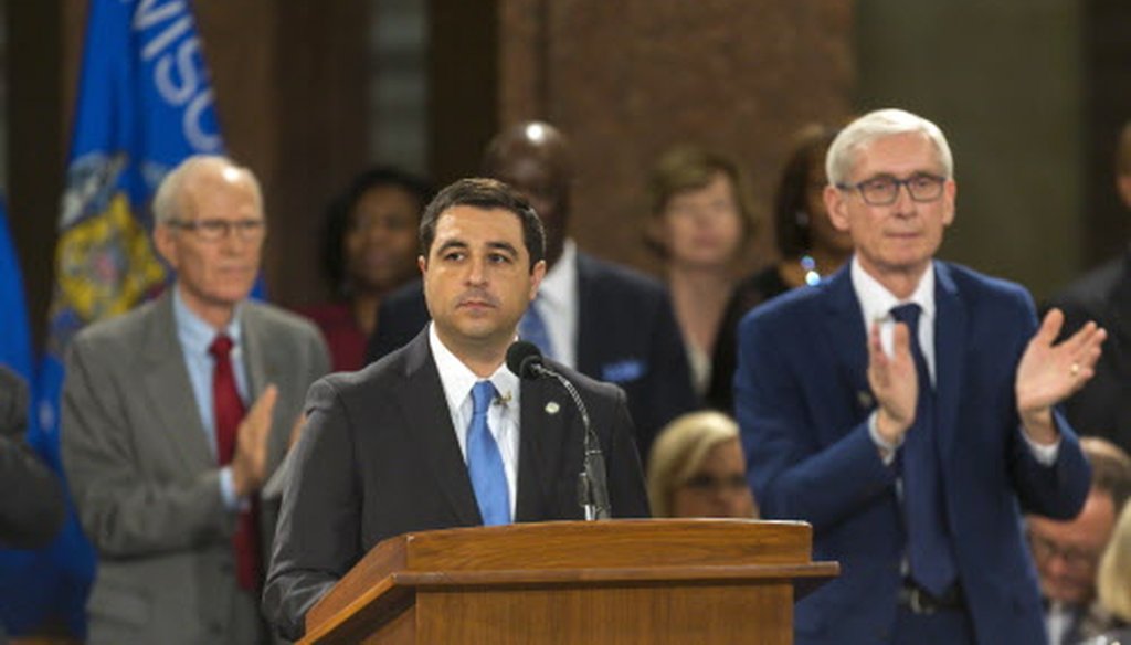 Wisconsin Attorney General Josh Kaul gets a standing ovation during his address at the inauguration of Gov. Tony Evers (right) at the state Capitol, Jan. 7, 2019, in Madison. (Andy Manis/Associated Press).