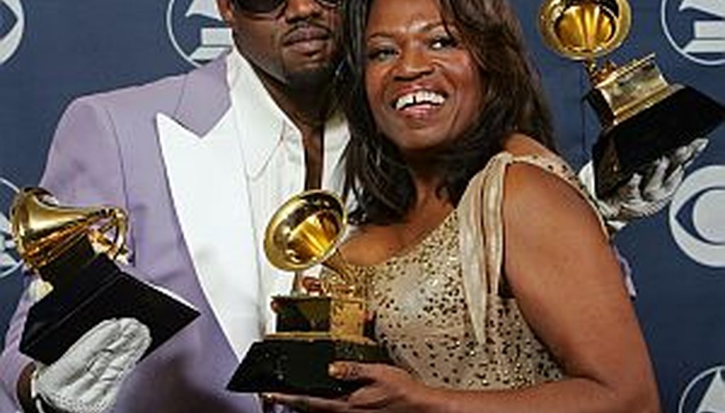 Kanye West and his mother Donda hold his three awards backstage at the 48th Annual Grammy Awards in this Feb. 8, 2006, in Los Angeles. West won for best rap album, solo and song. (AP Photo/Reed Saxon, file) 