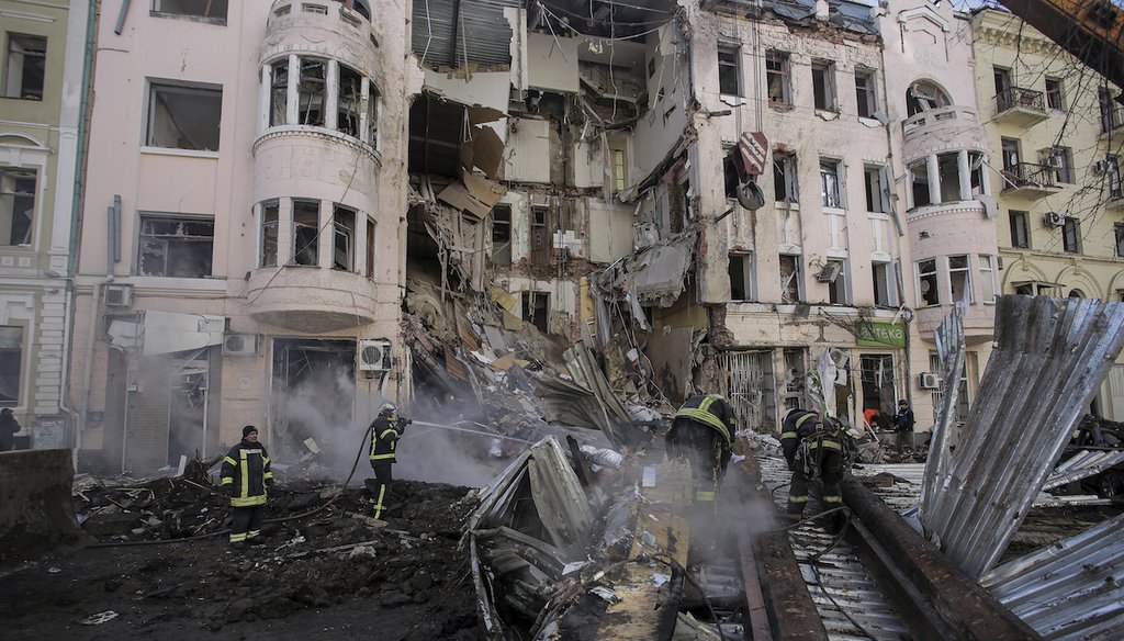 Firefighters at an apartment house following a Russian rocket attack in Kharkiv, Ukraine's second-largest city. (AP)