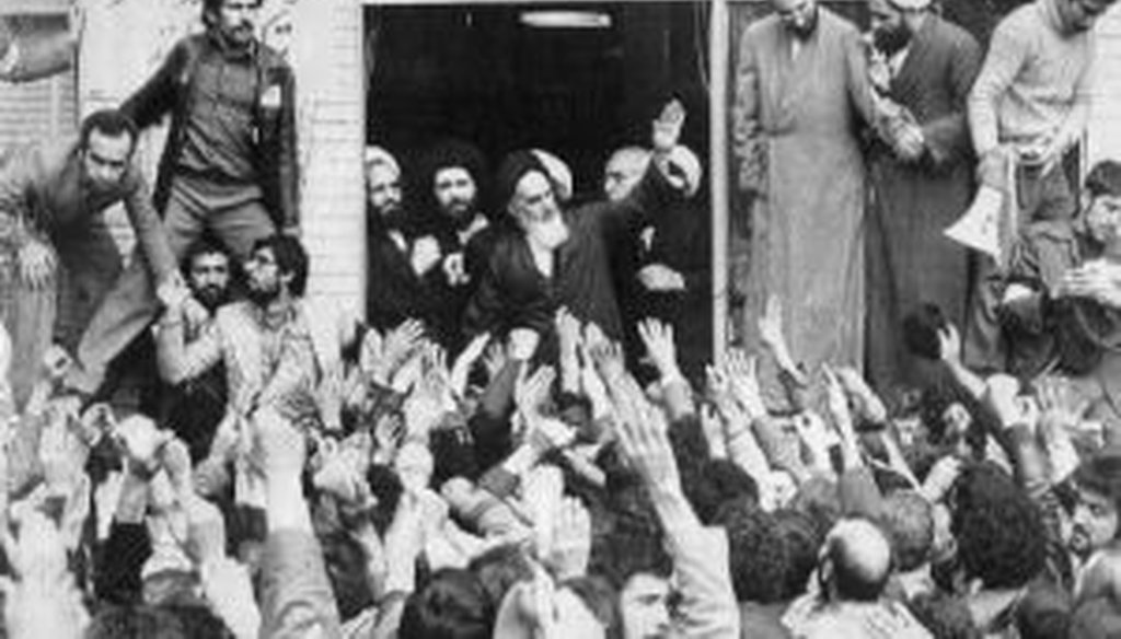 A sea of hands greets Iranian religious leader Ayatollah Ruhollah Khomeini in 1979, shortly after his return to Tehran from exile in Paris. (Associated Press)