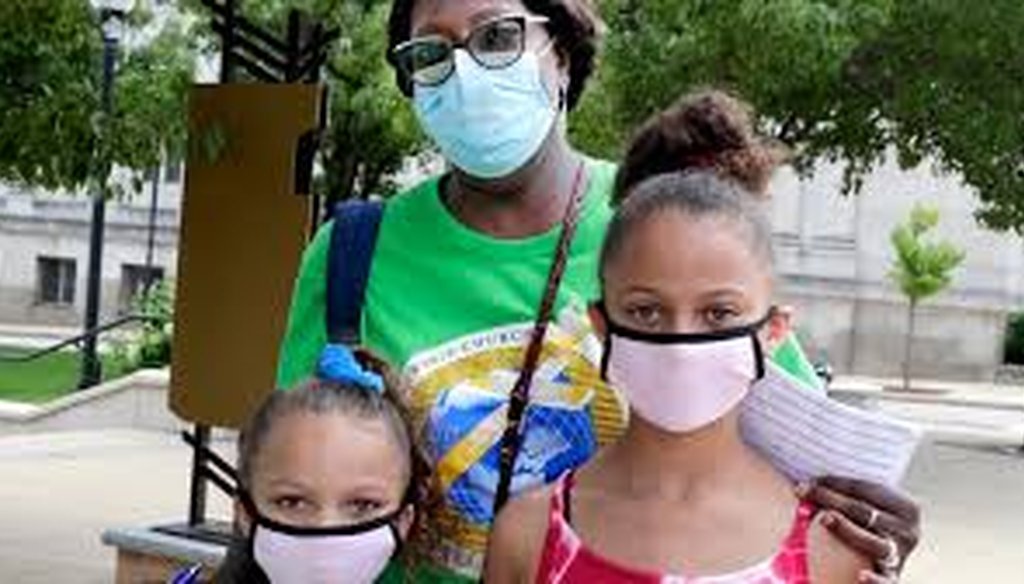 Jerrilyn Johnson of Racine and granddaughters Dalani Finley, 7, and Dailynn Finley, 10, are masked while out and about Saturday, Aug. 1, 2020, the first day of Gov. Tony Evers' mandate requiring them to be worn indoors. (Rick Wood/Milw. Journal Sentinel)l