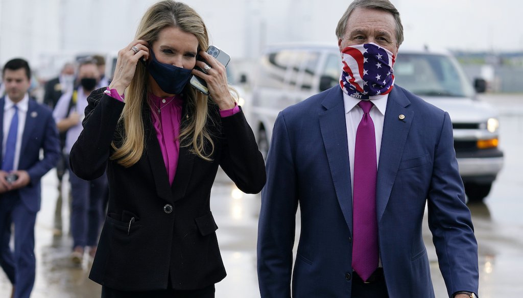 U.S. Sens. Kelly Loeffler and David Perdue, both Georgia Republicans, are shown at UPS Hapeville Airport Hub in Atlanta on July 15, 2020. They called on the GOP Georgia secretary of state to resign in the wake of the Nov. 3, 2020, elections. (AP)
